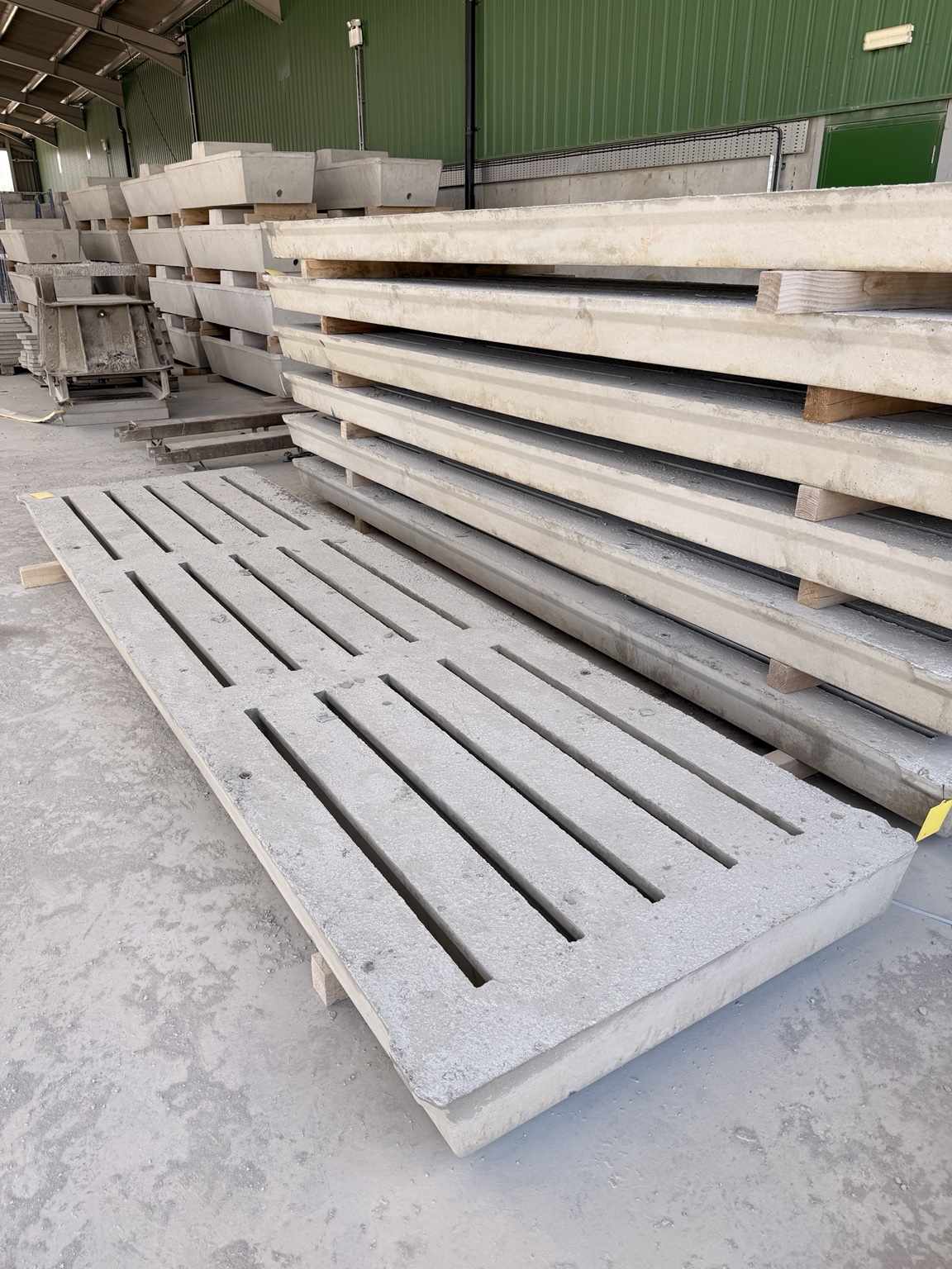WCCP precast concrete cattle slats, slotted top face, stacked at the Holsworthy yard