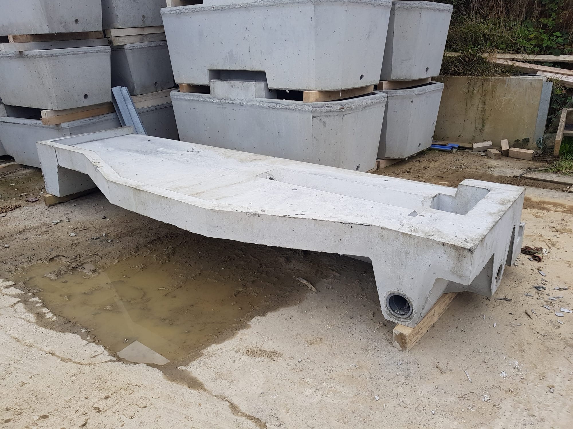 Cast precast concrete DeLaval VMS robot base in the WCCP yard at Holsworthy showing the integrated drainage gully and sump, Devon
