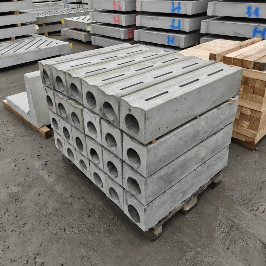 Stack of WCCP slatted precast slurry-channel covers ready for despatch