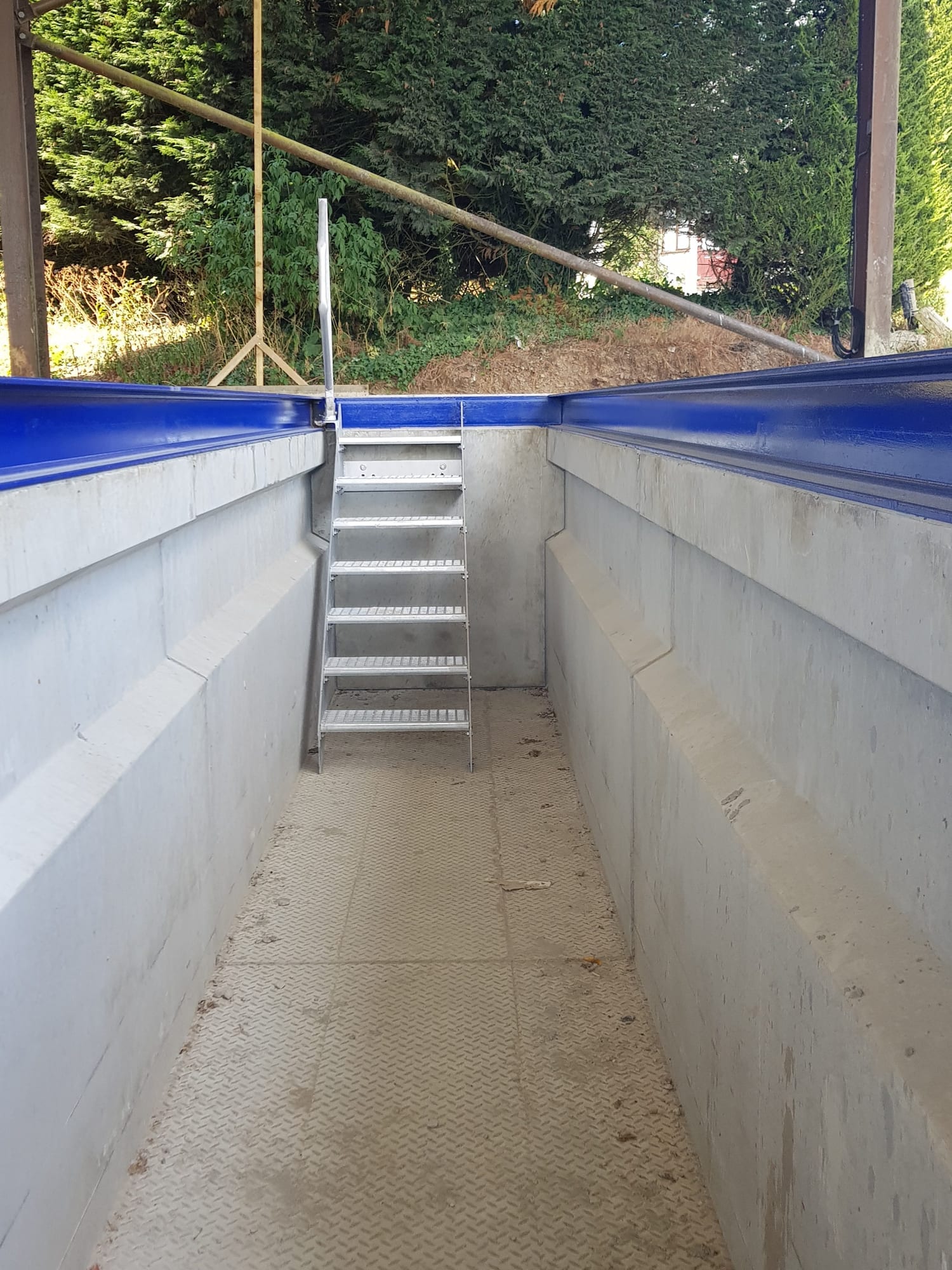 WCCP precast concrete workshop pit showing optional cast-in galvanised steel steps to one end, Devon