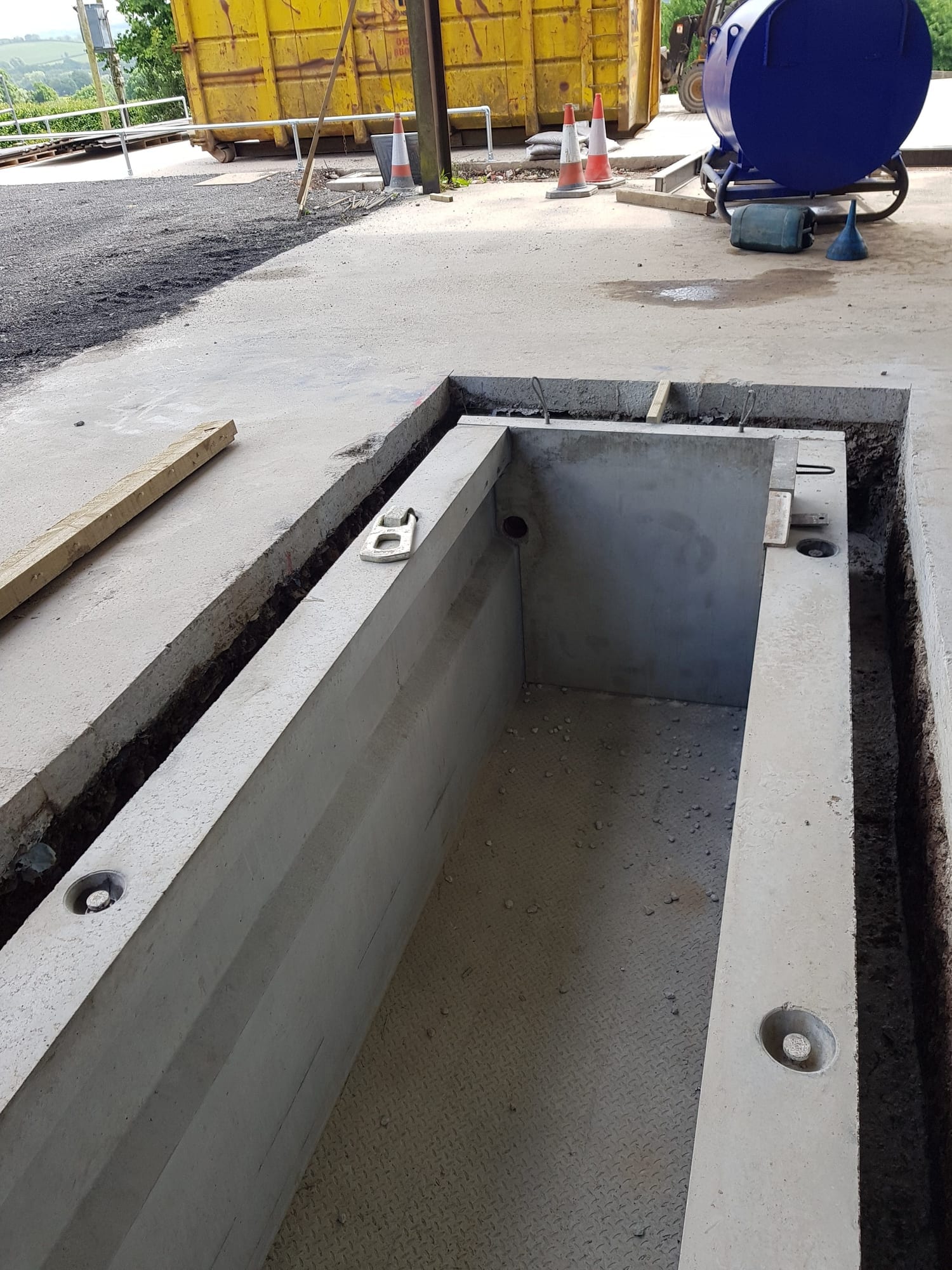 Close-up of cast-in lifting points and end wall on a WCCP precast concrete vehicle inspection pit, Devon