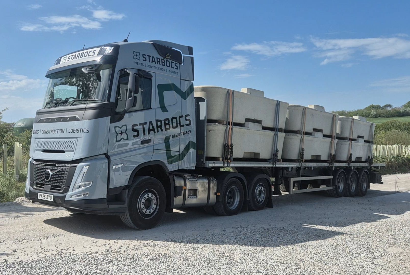WCCP 500-gallon precast concrete water troughs loaded on a flatbed lorry leaving Holsworthy, Devon for a Shropshire dairy