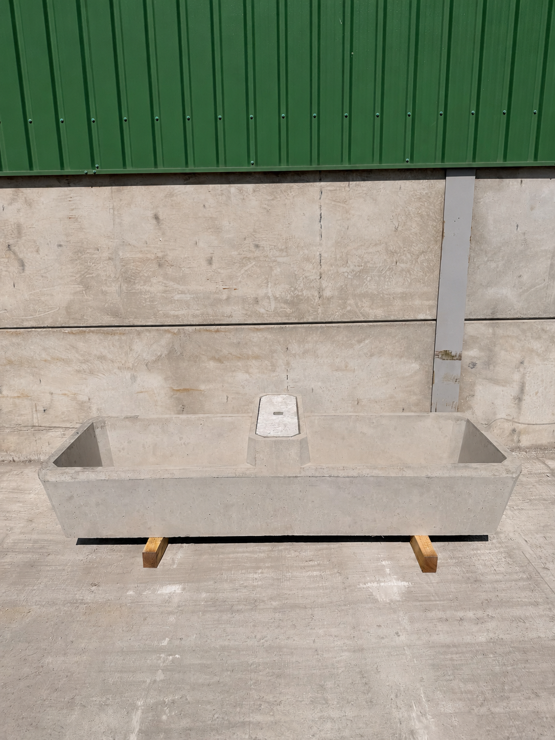 Smaller precast concrete livestock drinking trough on timber dunnage at the WCCP yard